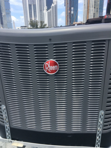 Commercial HVAC crane operation for heavy equipment placement