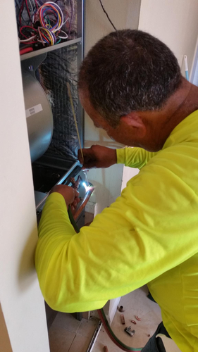 Professional HVAC installation team working on complex project